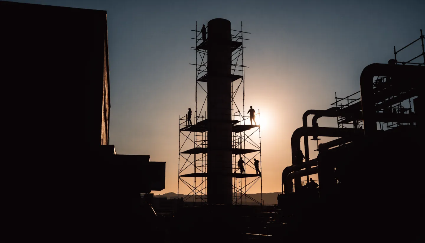 Technicians working on pipework during an industrial site intervention